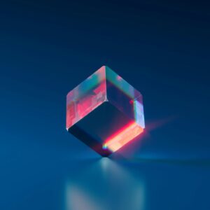 A vibrant and futuristic 3D cube with glowing edges on a dark blue background.